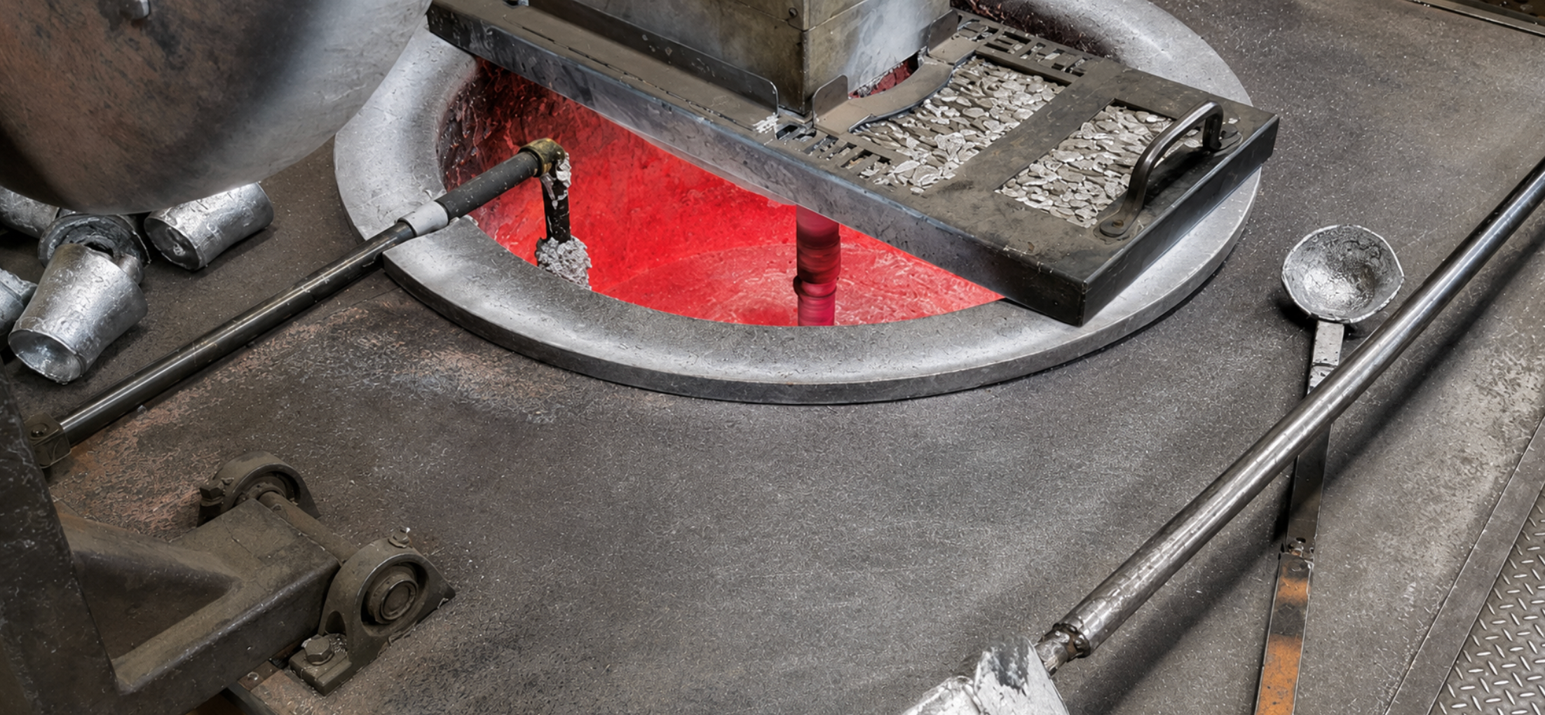 Aluminum furnace with glowing molten metal at Muncie Castings